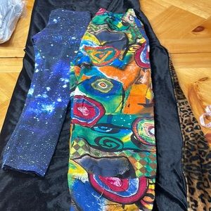 Two pairs colorful pants! Size L. Purple, blues, wild prints!! NH5